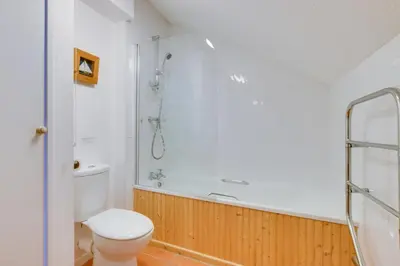 a bathroom with a shower and a toilet at 1 Bed in St Ives oc-nic48 in St Ives