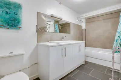 a white bathroom with a sink and a tub at 1 Bed in St Ives oc-nic049 in St Ives