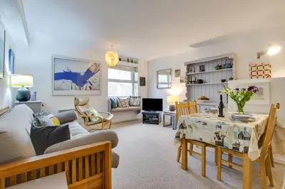 a living room with a couch and a table at 1 Bed in St Ives oc-nic049 in St Ives