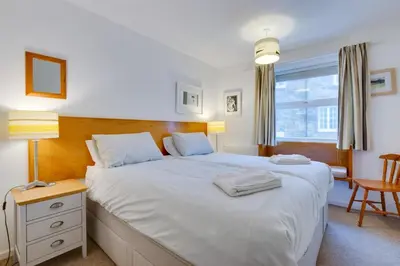 a bedroom with a large white bed and a window at 1 Bed in St Ives oc-nic049 in St Ives