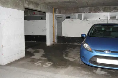a blue car parked in a parking garage at 1 Bed in St Ives oc-nic049 in St Ives