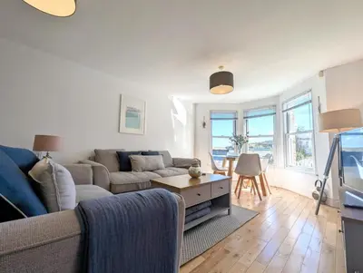 a living room with a couch and a table at 2 Bed in St Ives oc-pedtc1 in St Ives