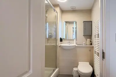 a bathroom with a shower and a toilet and a sink at 2 Bed in St Ives oc-pedtc1 in St Ives