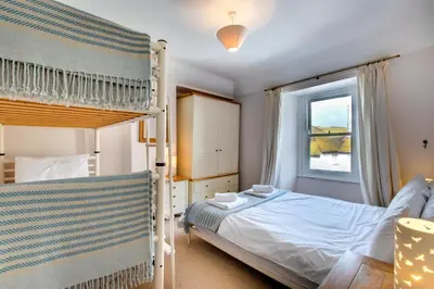 a bedroom with a bunk bed and a window at 2 Bed in St Ives oc-pmho08 in St Ives