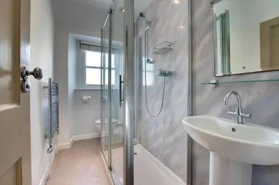 a bathroom with a shower and a sink and a toilet at 2 Bed in St Ives oc-pmho08 in St Ives