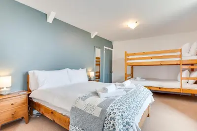 two beds in a room with two bunk beds at 2 Bed in St Ives oc-pmho10 in St Ives
