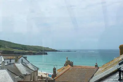 a view of a beach and the ocean with buildings at 2 Bed in St Ives oc-pmho10 in St Ives
