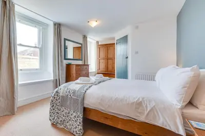 a bedroom with a large bed and a window at 2 Bed in St Ives oc-pmho10 in St Ives