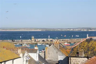 a view of a harbor with boats in the water at 2 Bed in St Ives oc-pmho10 in St Ives