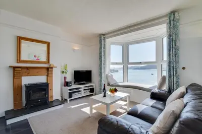 a living room with a couch and a fireplace at 1 Bed in St Ives oc-quayst in St Ives