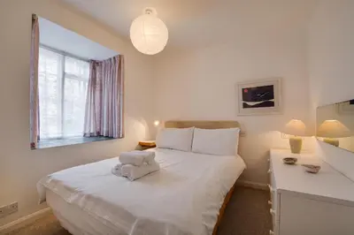 a bedroom with a white bed and a window at 2 Bed in St Ives oc-redc4 in St Ives
