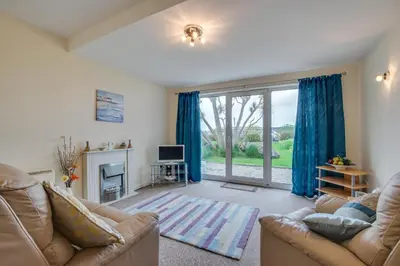 a living room with a couch and a tv and a fireplace at 1 Bed in St Ives oc-seacft in St Ives