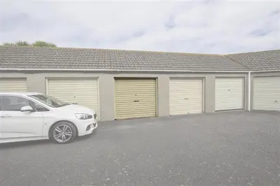 a white car parked in front of a garage at 1 Bed in St Ives oc-seacft in St Ives