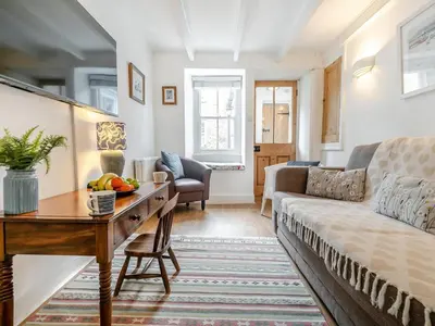 a living room with a couch and a table at 2 Bed in St Ives oc-shell in St Ives