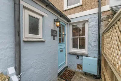 a blue house with a blue door and a window at 2 Bed in St Ives oc-shell in St Ives