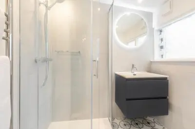 a white bathroom with a shower and a sink at 2 Bed in St Ives oc-shell in St Ives