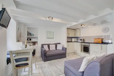 a living room with a couch and a table at 2 Bed in St Ives oc-stg019 in St Ives