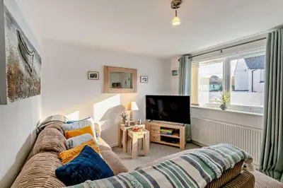a living room with a couch and a tv at 2 Bed in Carbis Bay oc-t27418 in Carbis Bay
