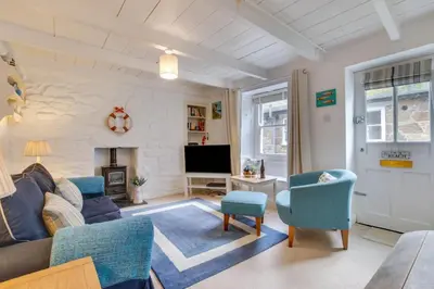 a living room with a couch and chairs and a tv at 2 Bed in St Ives oc-tee009 in St Ives