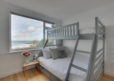 a bedroom with a bunk bed and a window at 3 Bed in St. Ives oc-trecar in St Ives