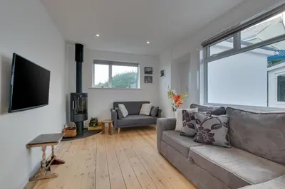 a living room with a couch and a tv at 3 Bed in St. Ives oc-trecar in St Ives