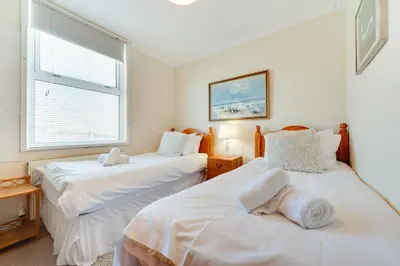 a bedroom with two beds and a window at 3 Bed in St Ives oc-twp32 in St Ives