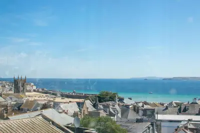 a view of a town with the ocean in the background at 3 Bed in St Ives oc-twp32 in St Ives