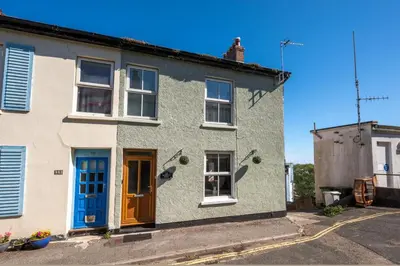 a white house with a blue door and windows at 3 Bed in St Ives oc-twp32 in St Ives