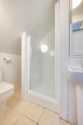 a bathroom with a shower and a toilet and a sink at 3 Bed in St Ives oc-twp32 in St Ives