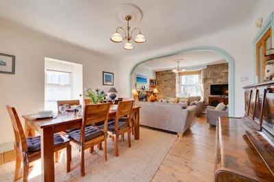 a dining room and living room with a table and chairs at 3 Bed in St Ives oc-twp32 in St Ives