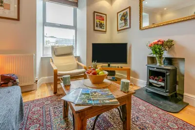 a living room with a coffee table and a television at 3 Bed in St Ives oc-twtc11 in St Ives