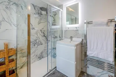 a bathroom with a sink and a shower at 3 Bed in St Ives oc-twtc11 in St Ives