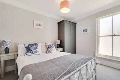 a bedroom with a bed and a window at 4 Bed in St. Ives oc-uppcr in St Ives