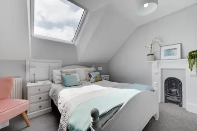 a white bedroom with a bed and a window at 4 Bed in St. Ives oc-uppcr in St Ives
