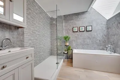 a bathroom with a shower and a tub and a sink at 4 Bed in St. Ives oc-uppcr in St Ives