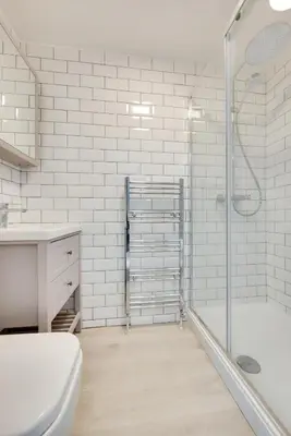 a bathroom with a shower and a toilet and a sink at 4 Bed in St. Ives oc-uppcr in St Ives