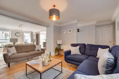 a living room with two blue couches and a table at 4 Bed in St. Ives oc-uppcr in St Ives