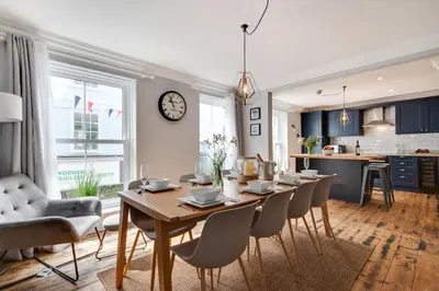 a dining room and kitchen with a table and chairs at 2 Bed in St. Ives oc-upper4 in St Ives