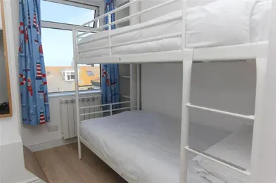 a bedroom with two bunk beds and a window at 2 Bed in St Ives oc-ven10a in St Ives
