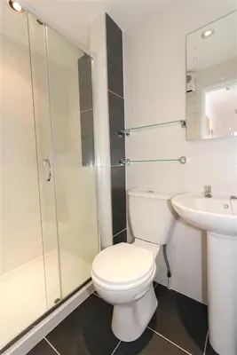 a white bathroom with a toilet and a sink at 2 Bed in St Ives oc-ven10a in St Ives