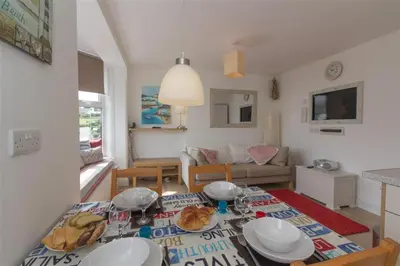 a living room with a dining table and a living room at 2 Bed in St Ives oc-ven10a in St Ives