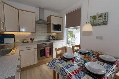 a kitchen with a table with a table cloth on it at 2 Bed in St Ives oc-ven10a in St Ives