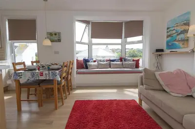 a living room with a table and a couch at 2 Bed in St Ives oc-ven10a in St Ives