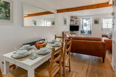 a living room with a table and a couch at 3 Bed in St Ives oc-vgn28 in St Ives