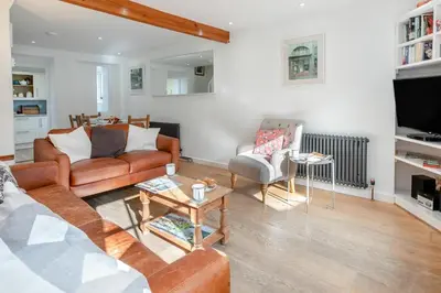 a living room with a couch and a table at 3 Bed in St Ives oc-vgn28 in St Ives