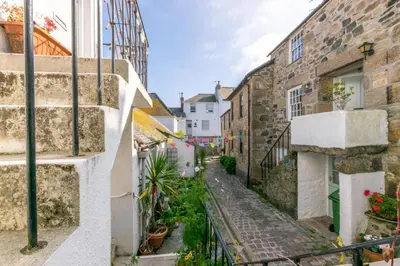 an alley in an old town with buildings at 3 Bed in St. Ives oc-virg14 in St Ives