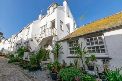 a white building with plants in front of it at 3 Bed in St. Ives oc-virg14 in St Ives