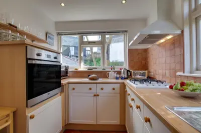 a kitchen with a sink and a stove top oven at 2 Bed in St. Ives oc-wesh4 in St Ives