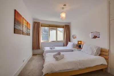 a bedroom with two beds and a window at 3 Bed in St Ives oc-weshs in St Ives