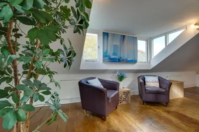 a living room with two chairs and a table at 3 Bed in St Ives oc-weshs in St Ives